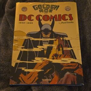 Taschen Golden Age of DC Comics Book with Yellow and Black Cover
